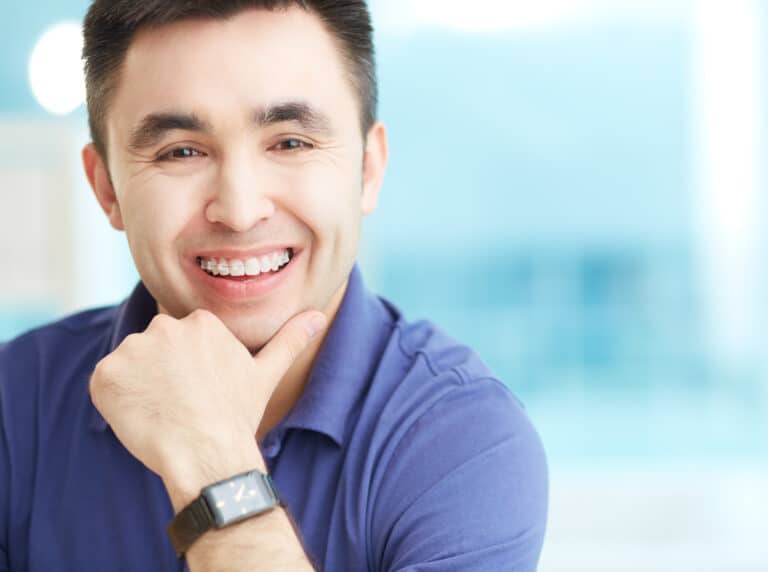 Portrait of cheerful businessman looking at camera with smile